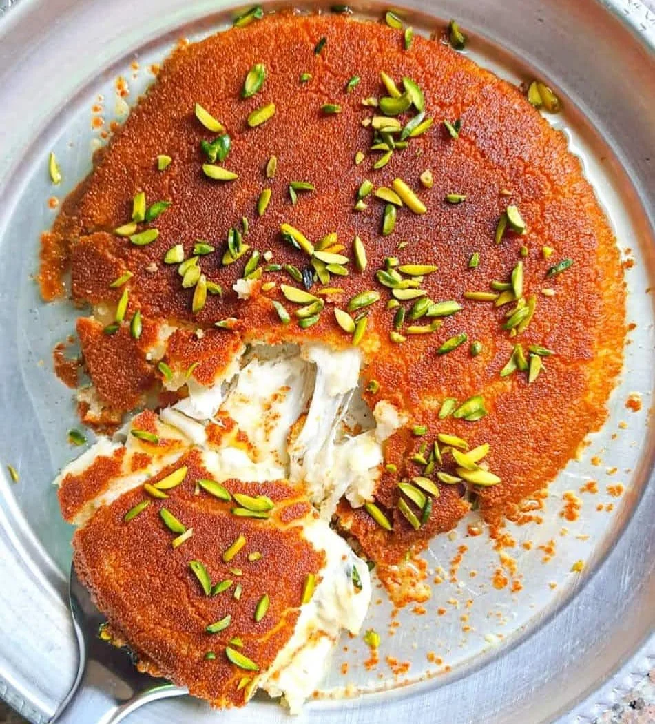 Knafeh Nabulsi – Nablus’ signature dessert with stretchy cheese, crisp pastry, and sugar syrup, often enjoyed at celebrations.
