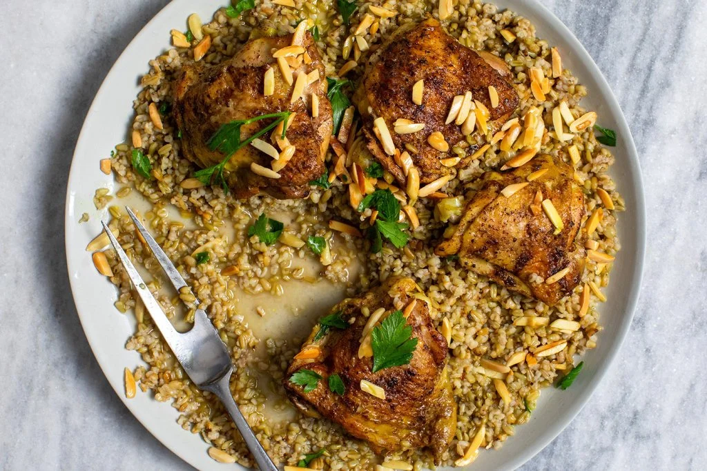 Freekeh With Chicken, Almonds and Yogurt Roasted green wheat with a smoky flavor, born from an ancient cooking accident, used in hearty stews, common in Jenin.