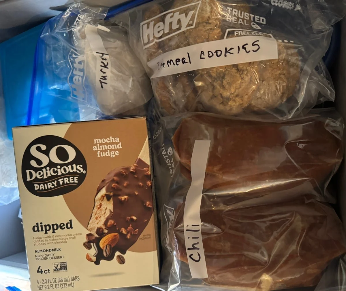 My freezer drawer with labeled gluten-free meals like chili, turkey, oatmeal cookies, and a dairy-free treat.