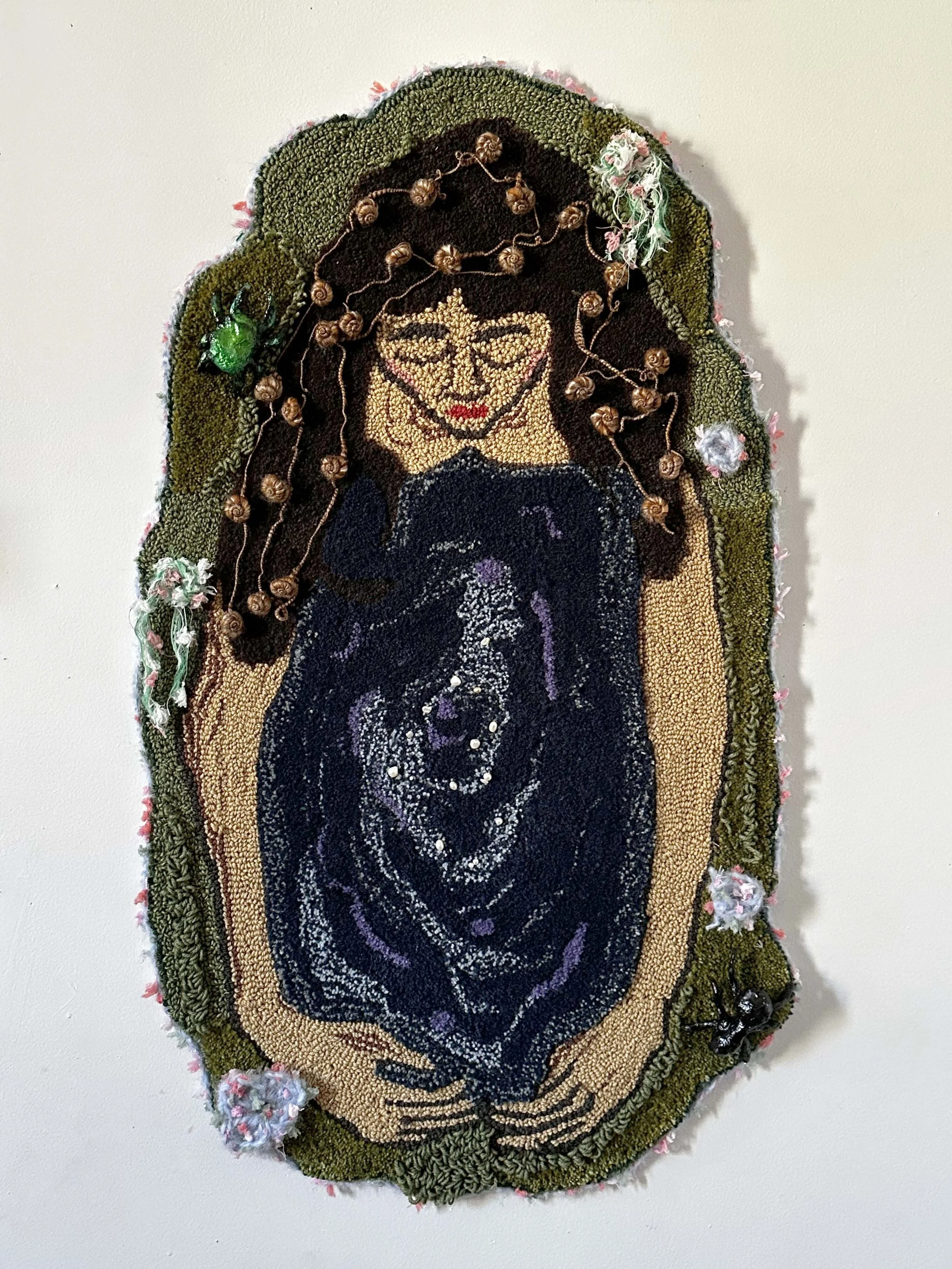 'I am the well' 2026. Tufted wool yarn, crocheted art yarn, pearls, and handmade plaster bugs. 24"x40"