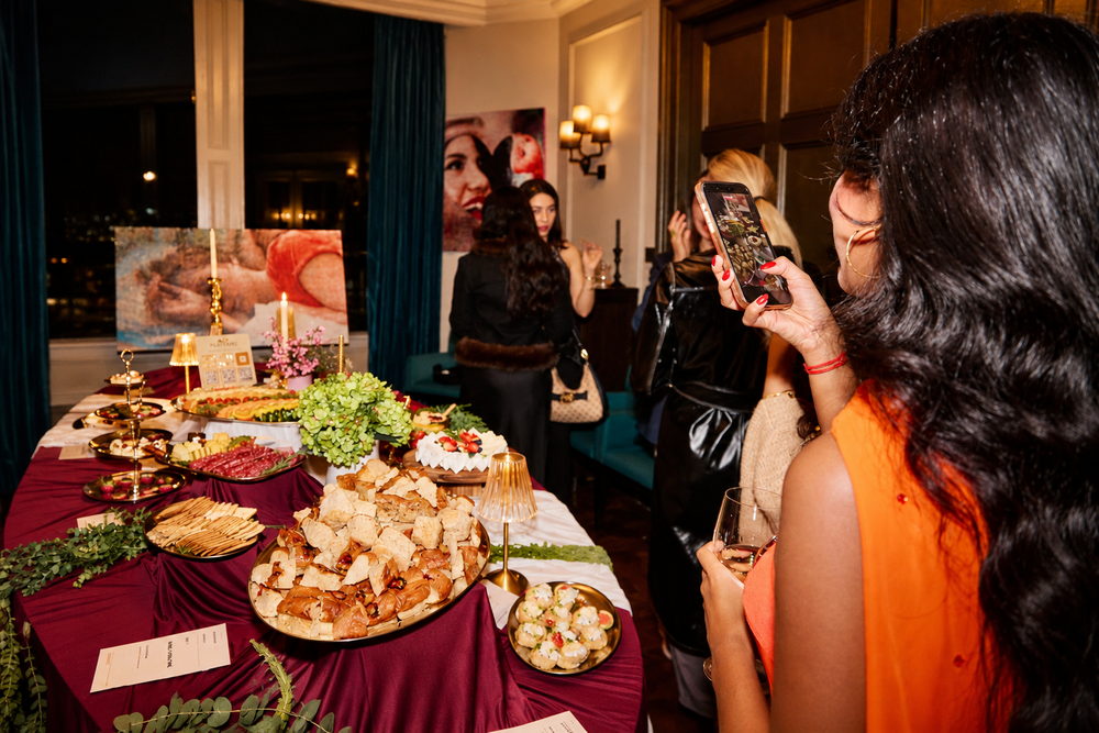 Candlelit Plattaire grazing table at an evening office party