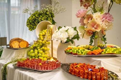Elevated grazing table with risers, flowers and charcuterie