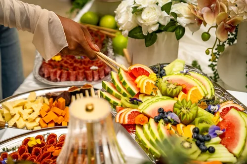 Fruit and charcuterie with white flowers