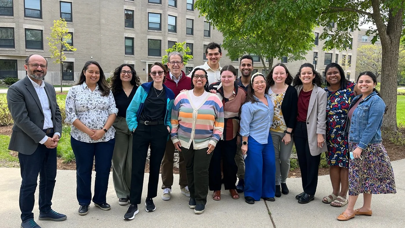 Group photo of the NCARE staff standing outdoors on campus.