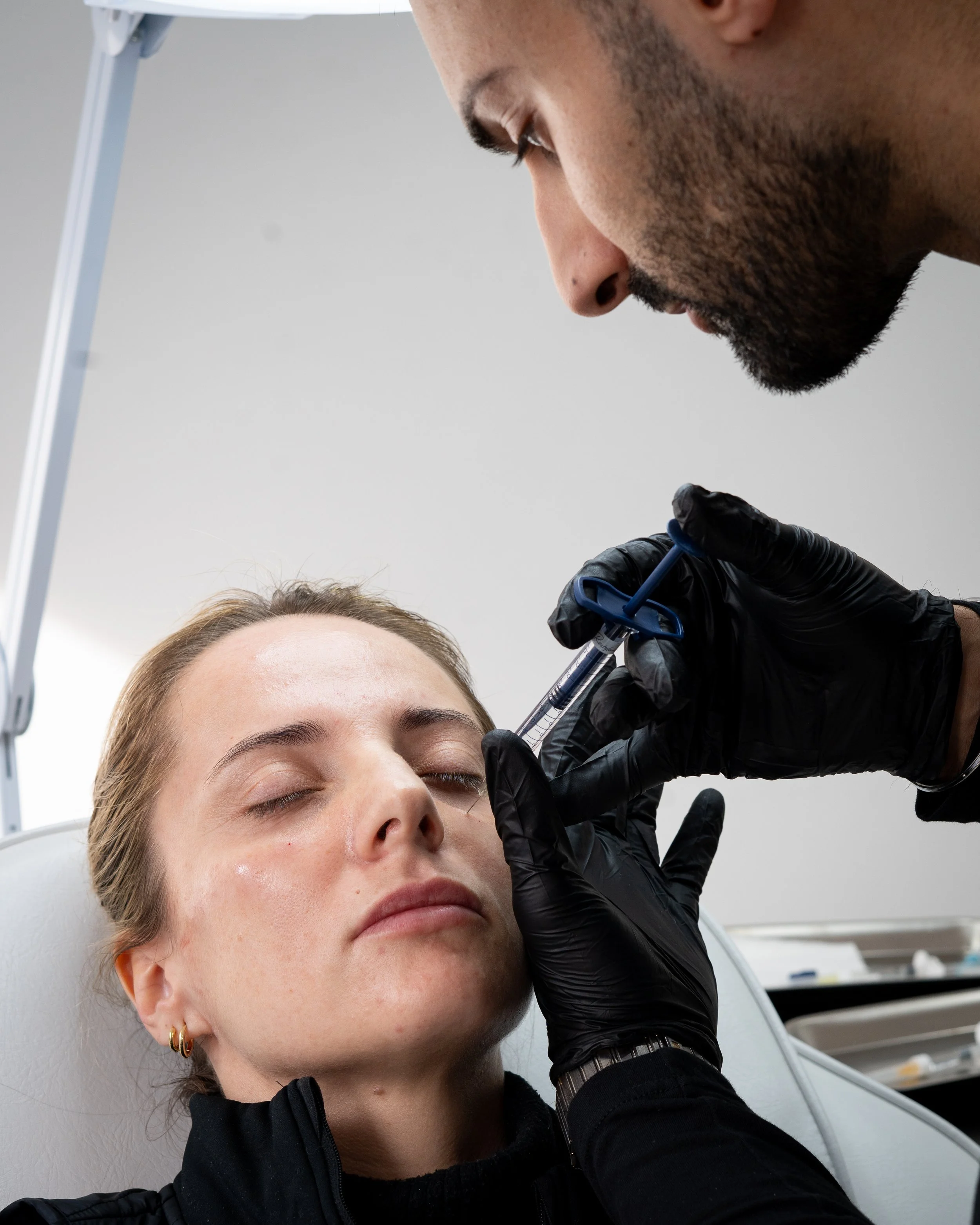 Best Aesthetic Doctor in London, Performing Facial rejuvenation with Cheek Contouring and Dermal Fillers in Harley Street at UKALM.