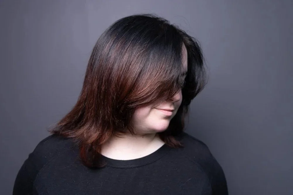 Long layered womens haircut on previously colored hair