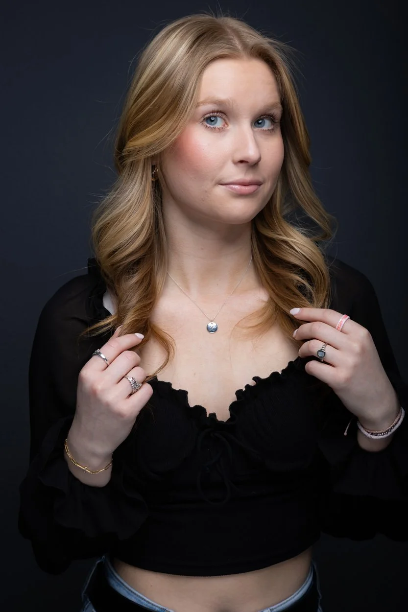 College graduate woman in a studio portrait