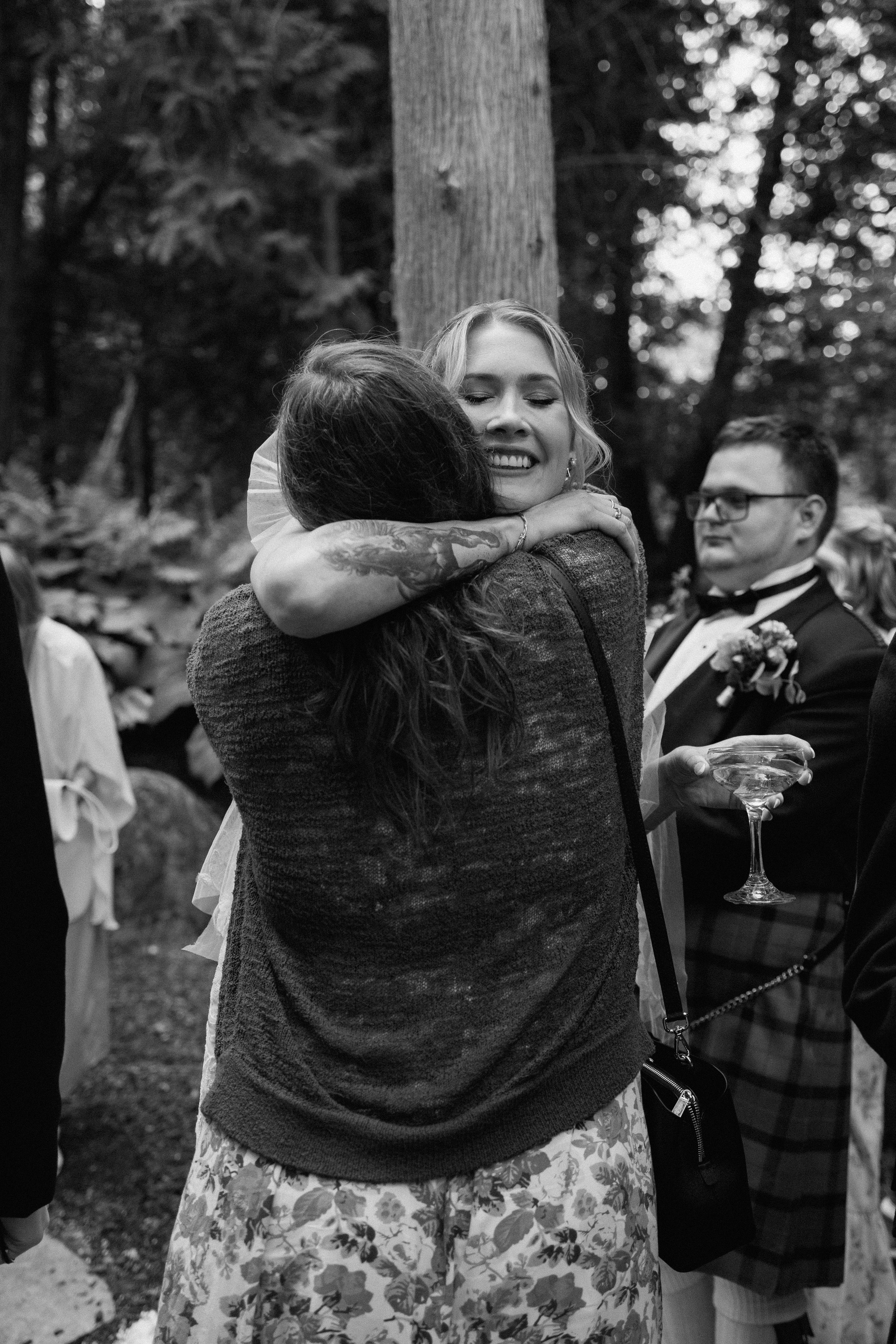 Bride hugging family member after getting married