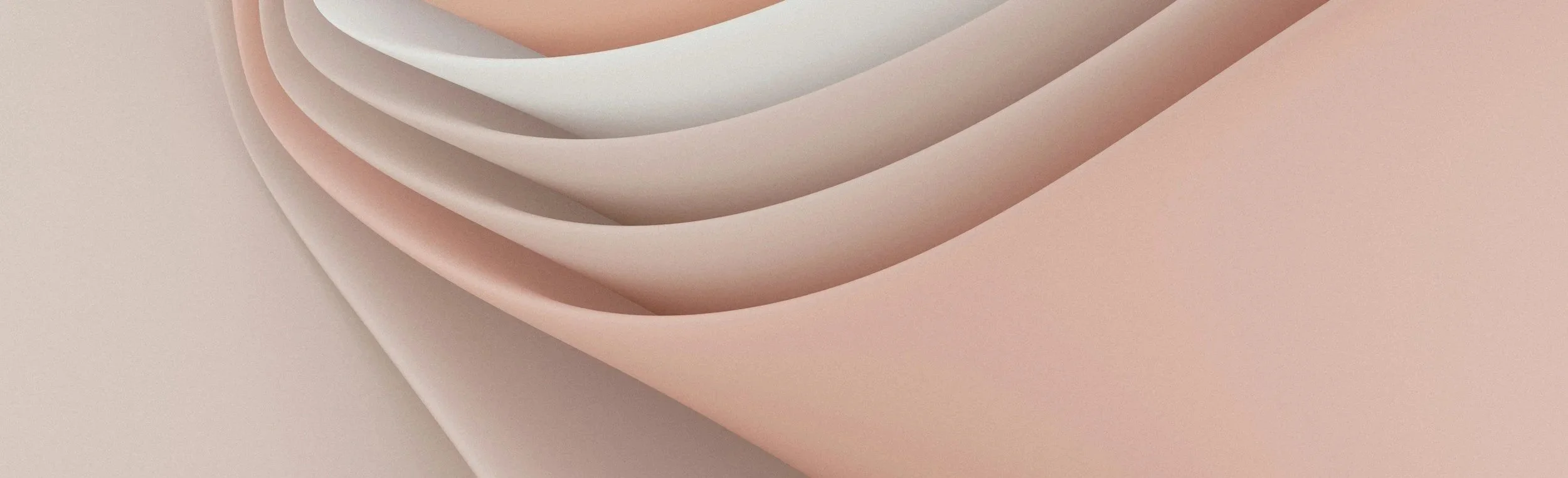 Abstract close-up of layered, curved shapes in soft pastel pink, beige, and cream colors.