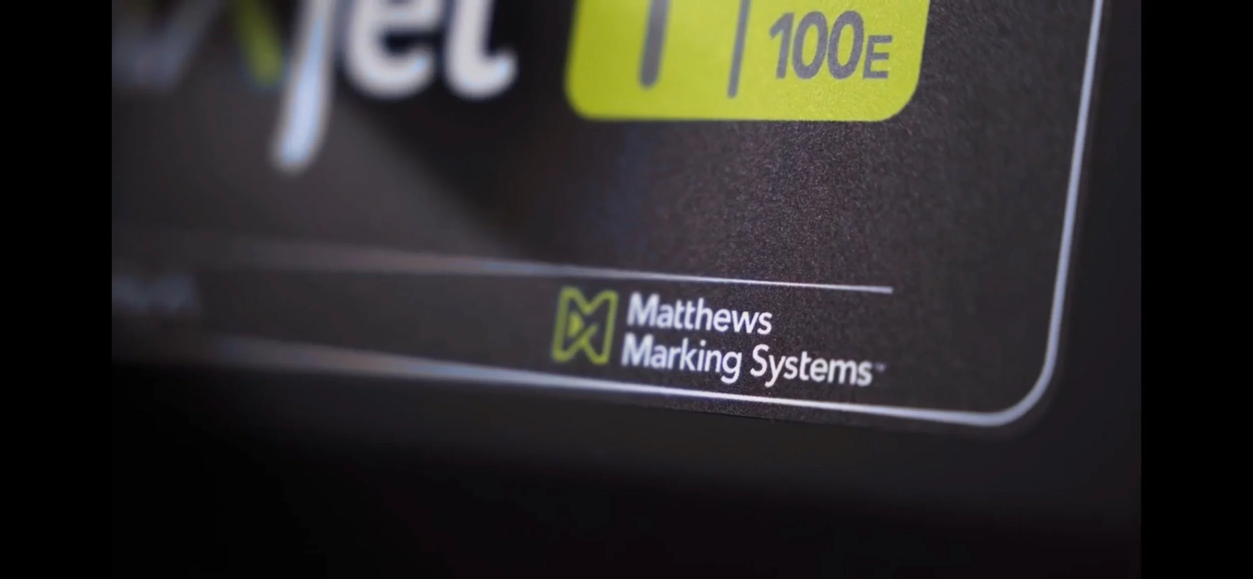 Close-up of a packaging label from Matthews Marking Systems showing part of the product and their logo.
