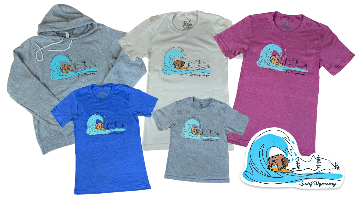 A collection of five t-shirts and a hoodie, each with a surf-themed graphic of a dog surfing a large wave with trees in the background and the text 'Surf Wyoming.'