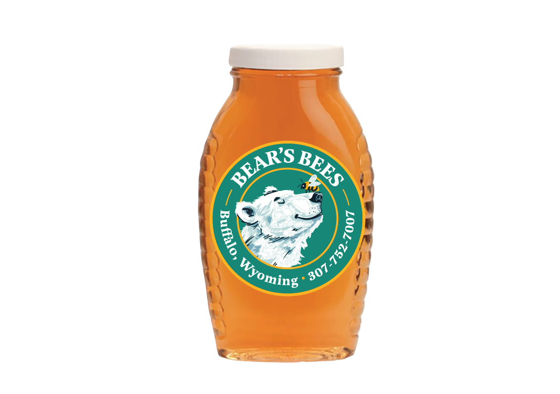 A jar of honey labeled 'Bear's Bees' with a bear's face in the logo and a bee flying near the bear's ear. The label indicates it is from Buffalo, Wyoming, with a phone number 307-732-7007.