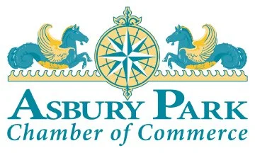 Logo of Asbury Park Chamber of Commerce featuring two blue and gold seahorses flanking a decorative gold and blue compass rose symbol.
