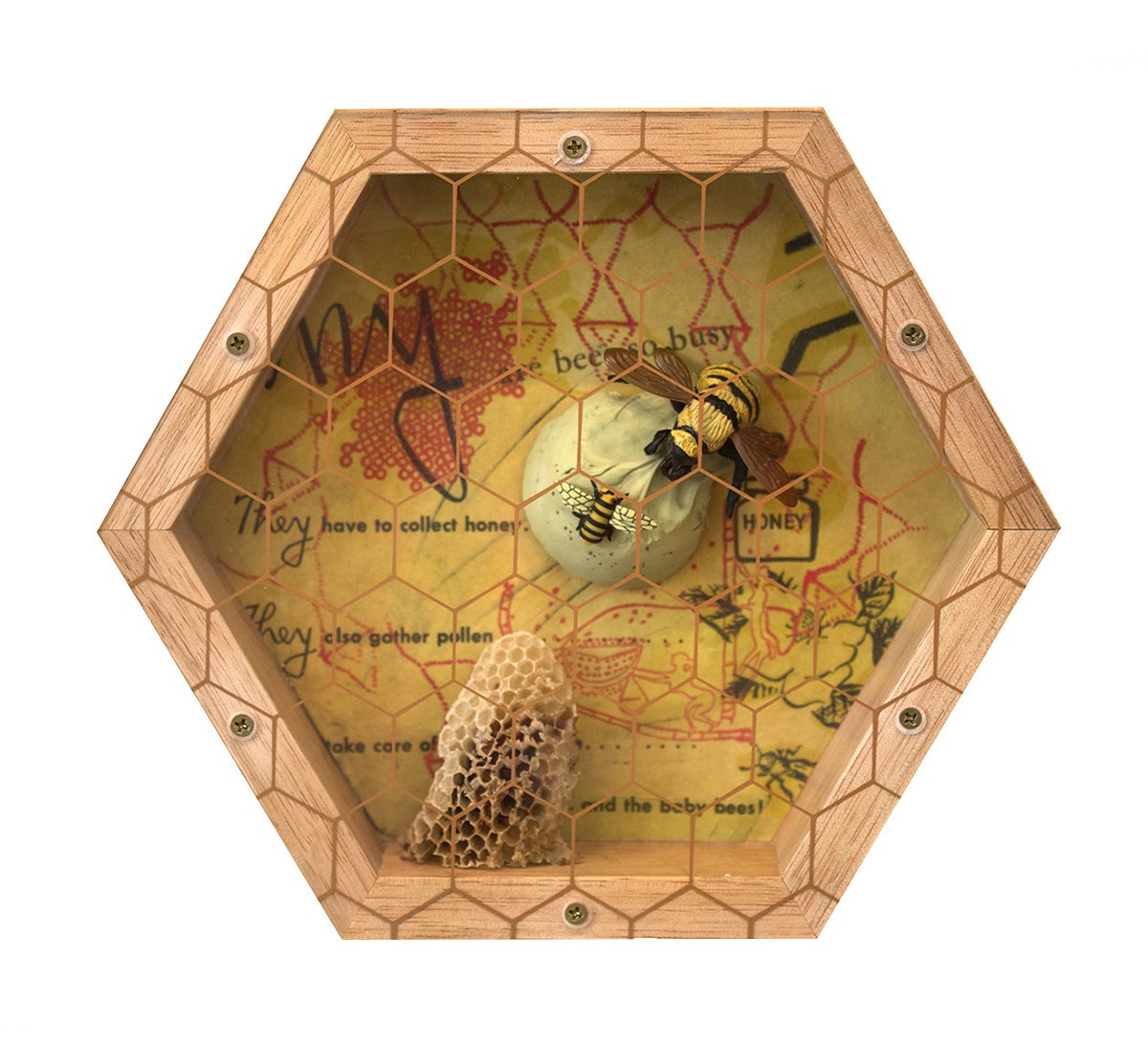 Decorative hexagonal bee observation box with honeycomb, a bee figurine, and honeycomb structure inside.