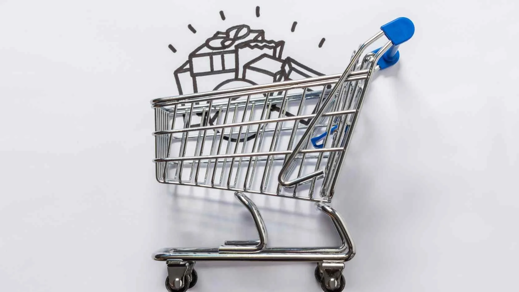 Miniature shopping cart against white background with a hand-drawn image of a cake and presents behind it.