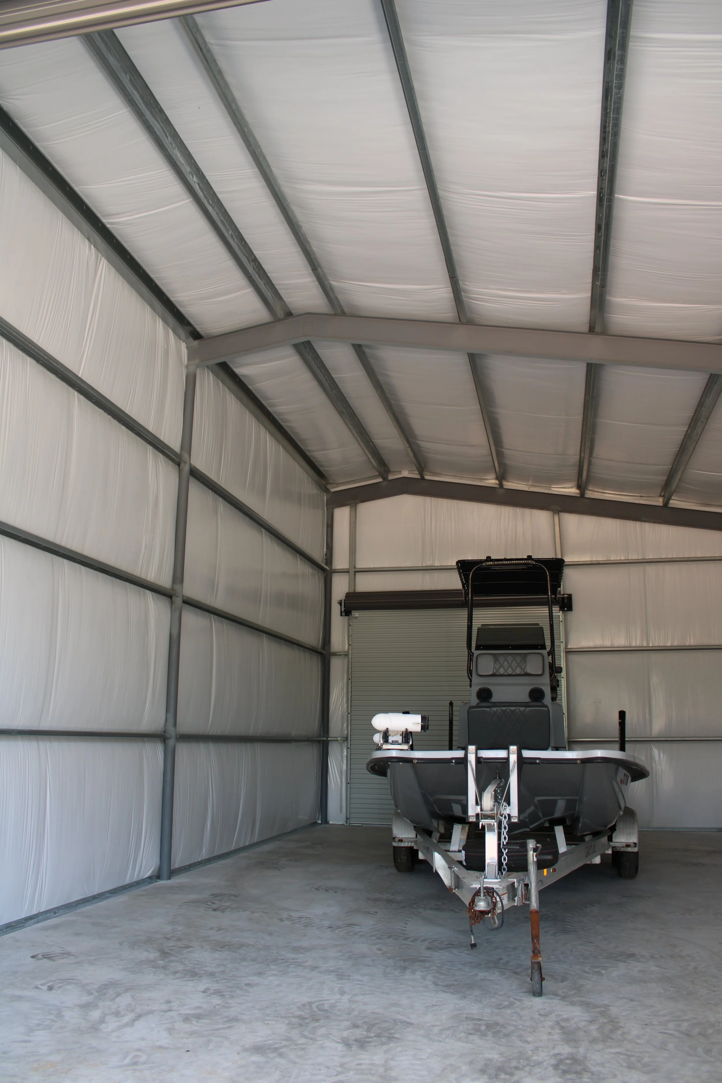 nterior view of insulated boat storage metal building in Richmond TX with 3” insulation, galvanized framing, and concrete slab