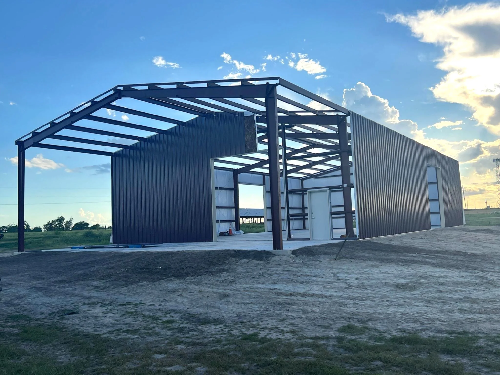 Metal Buildings vs. Wood Frame Construction: What Works Best in Texas Weather?