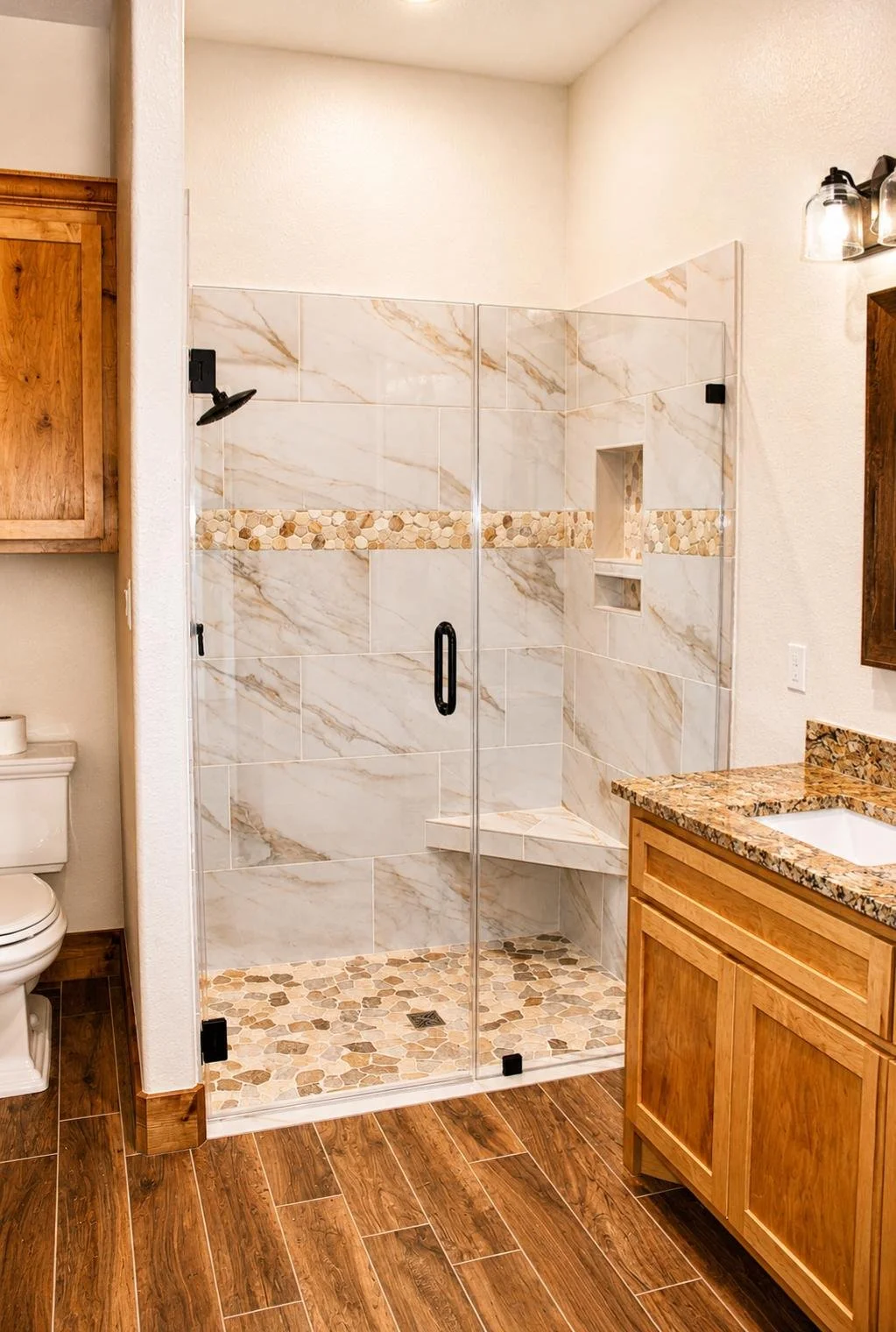 Rustic modern bathroom with oversized walk-in tile shower and matte black fixtures