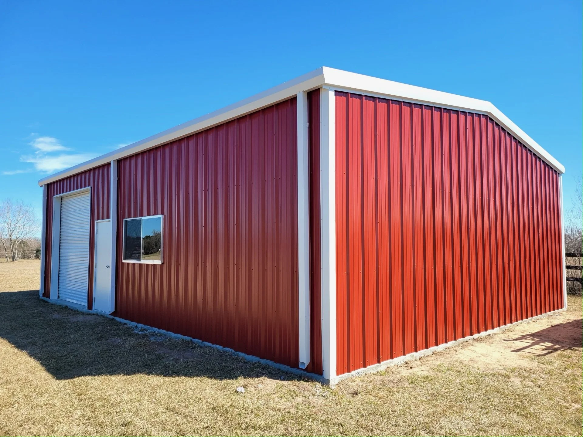 Red metal shop/garage with white trim in Central Texas
