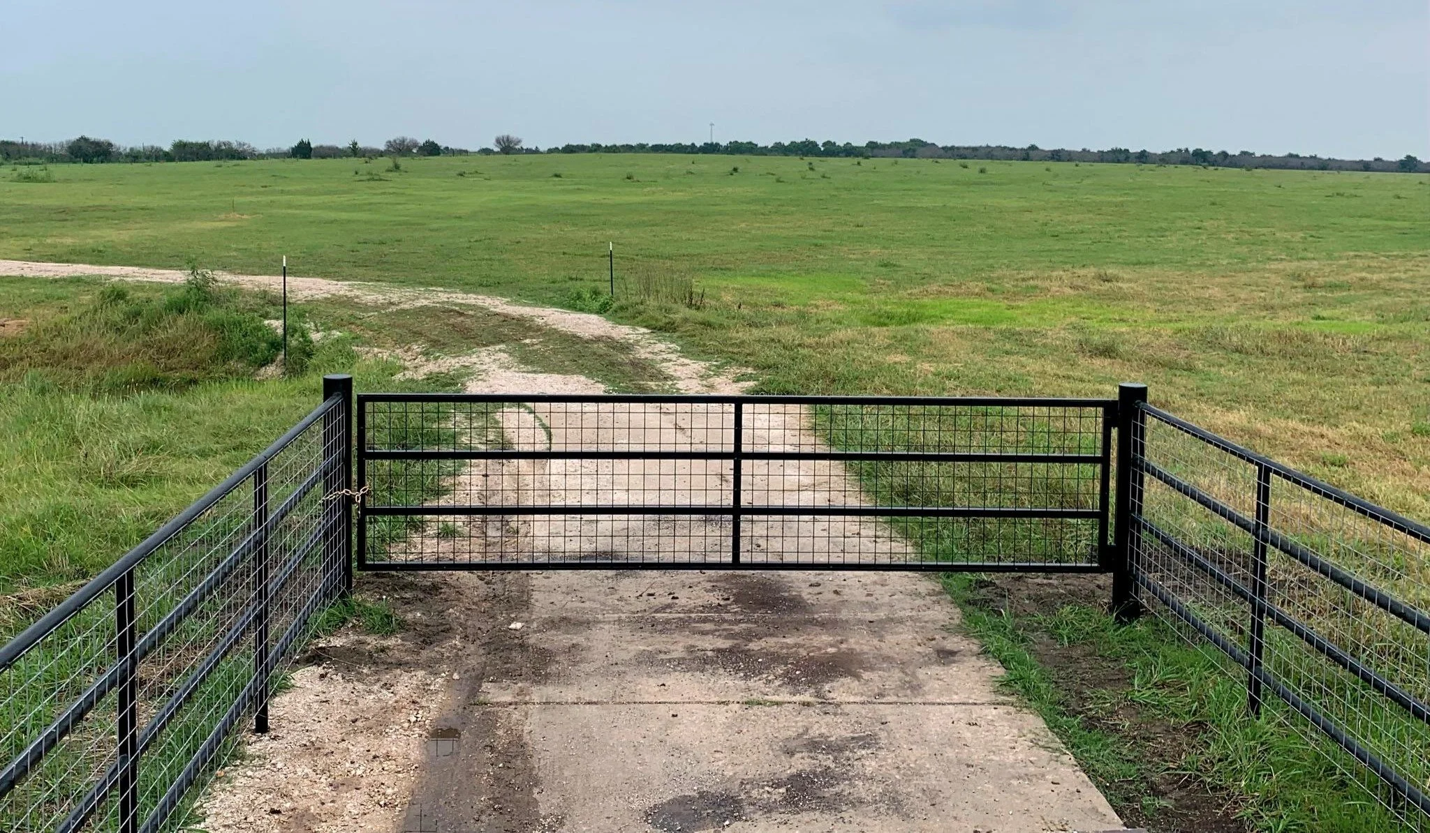 Custom livestock gate and fencing near Angleton Texas.