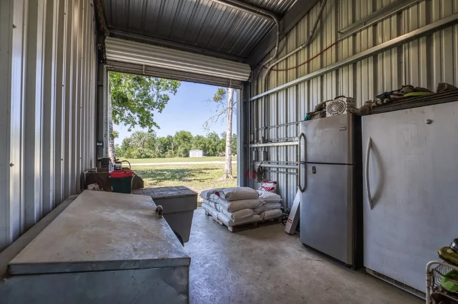 Enclosed feed room offering ample space for feed, supplements, refrigeration, and everyday horse-care supplies.