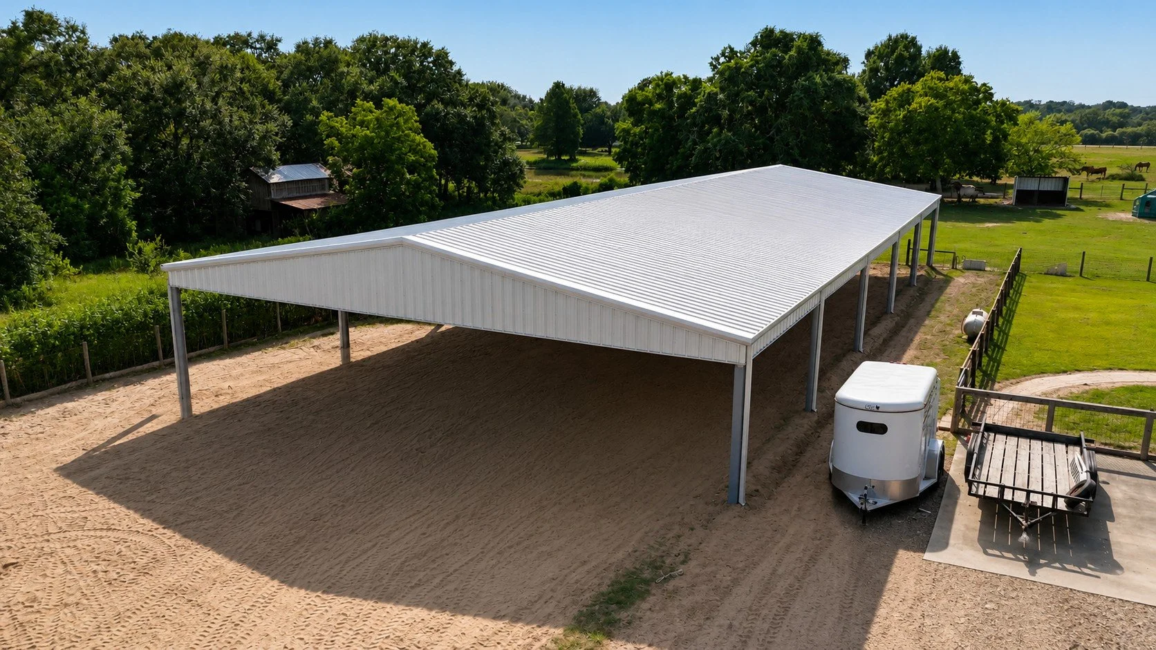 60x120 custom covered horse arena with Galvalume metal roof built by Wood's Construction in Needville, Texas.