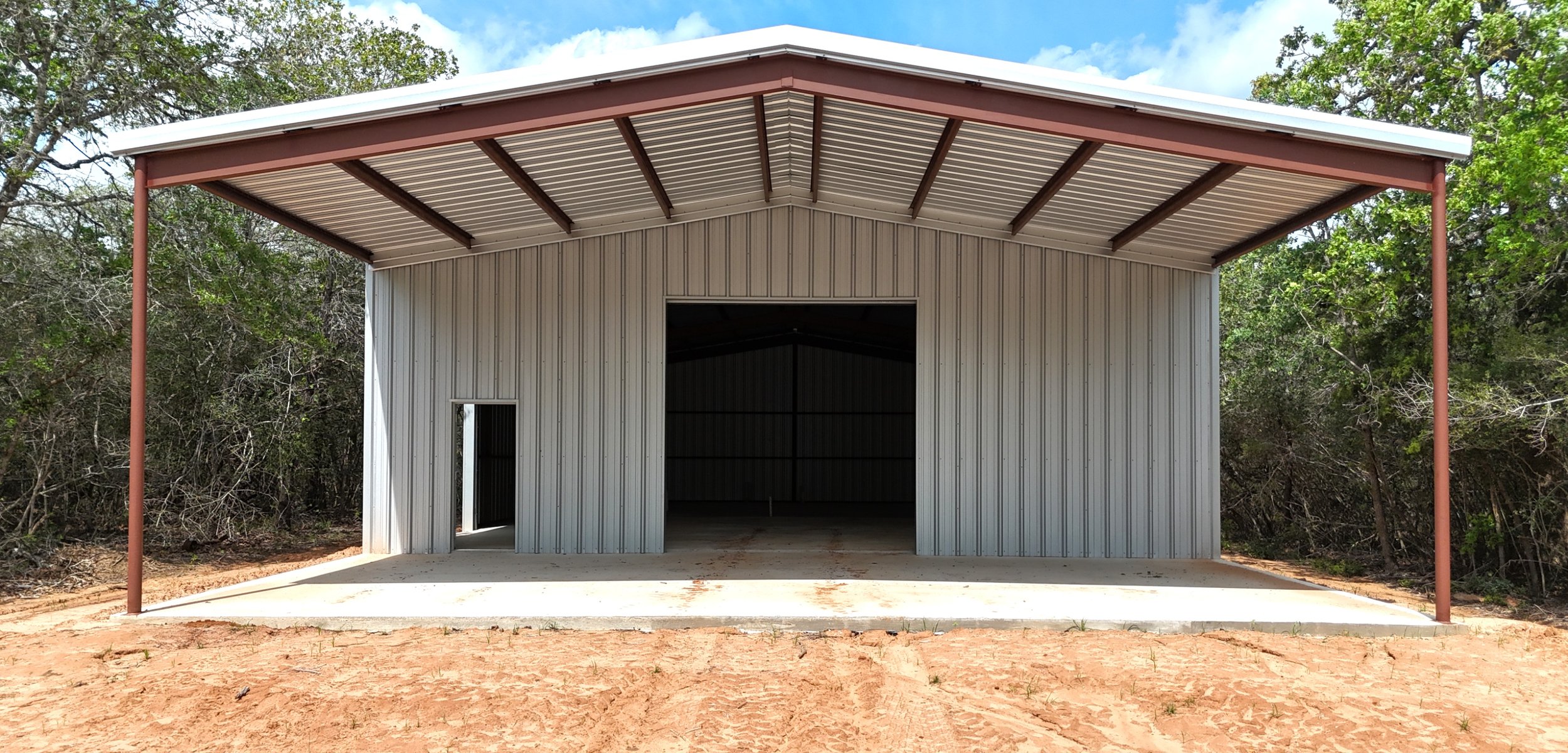 Custom Metal Shop with Full Front Awning — Waelder, TX