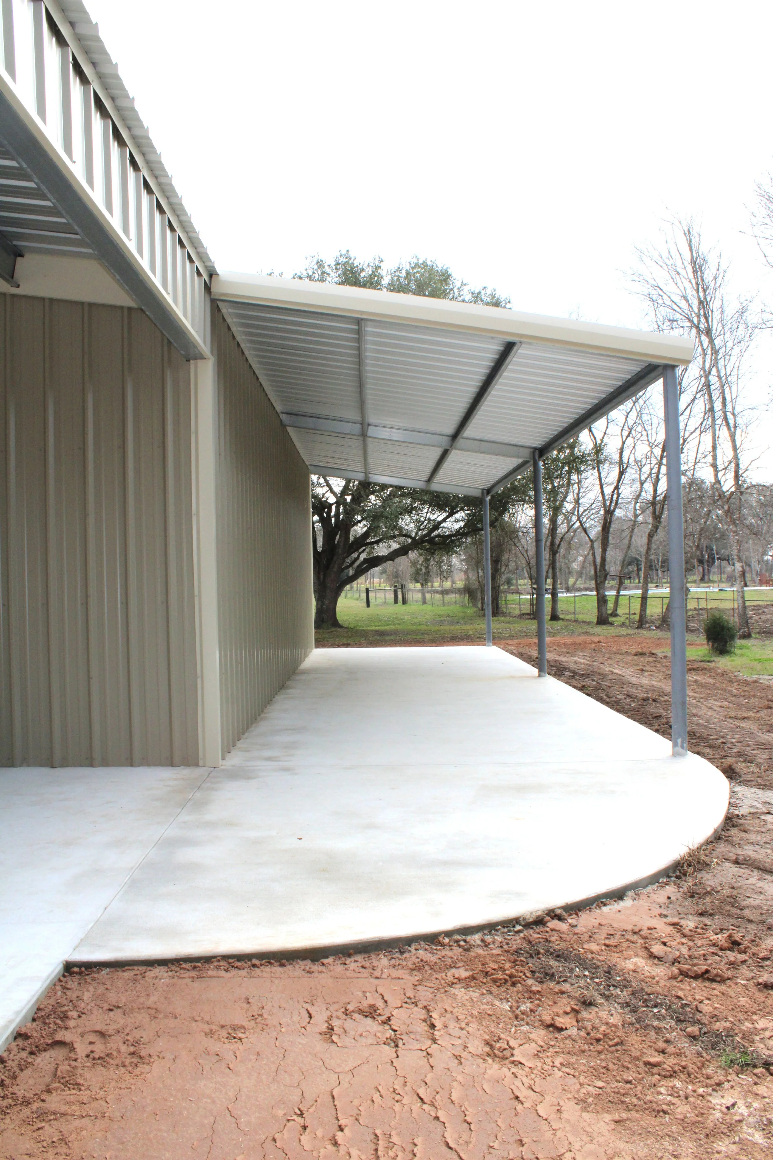 Curved concrete under lean-to in Damon TX