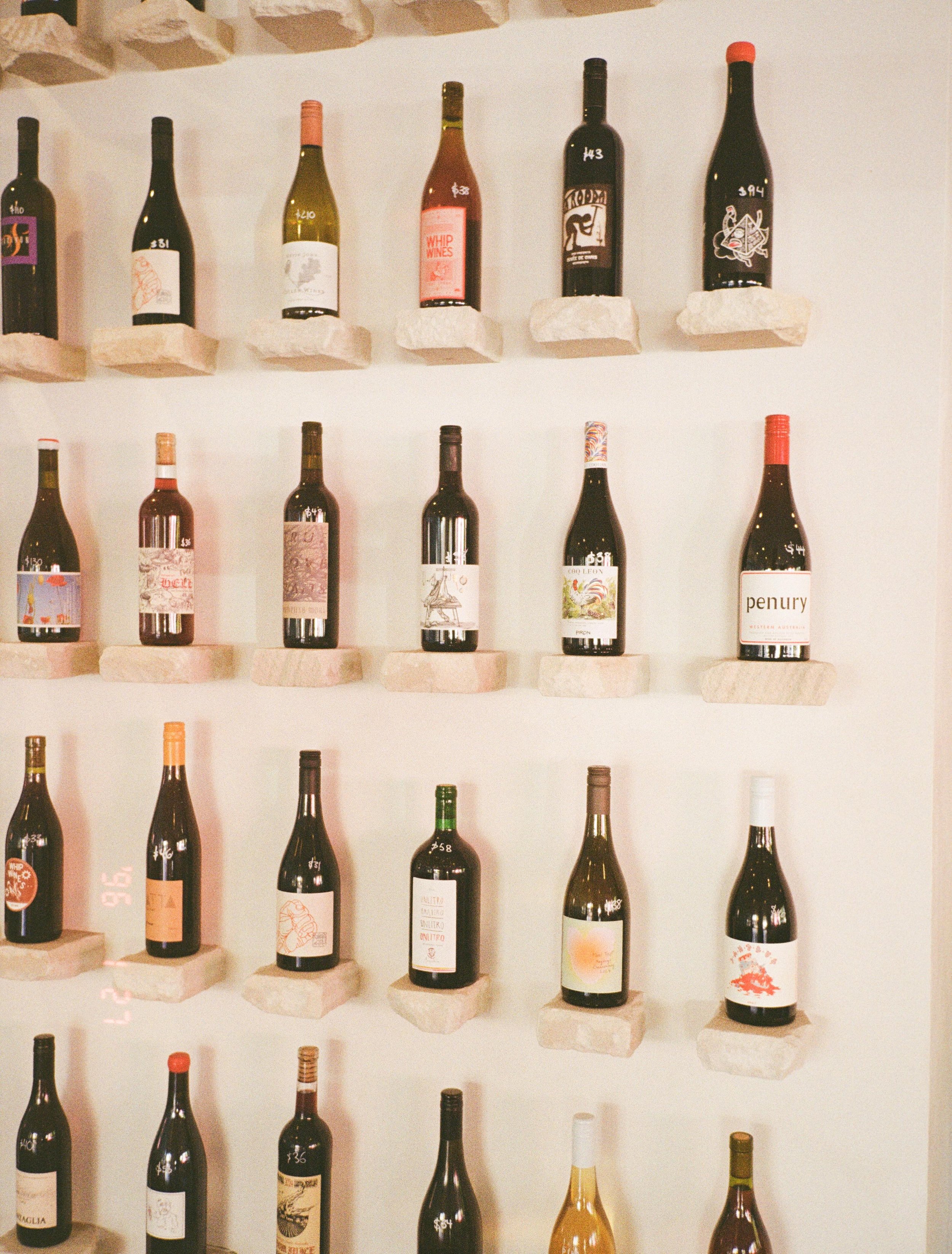 Wall of fav&rsquo;s 🍷 ~ rotating new arrivals. 🤌🏼