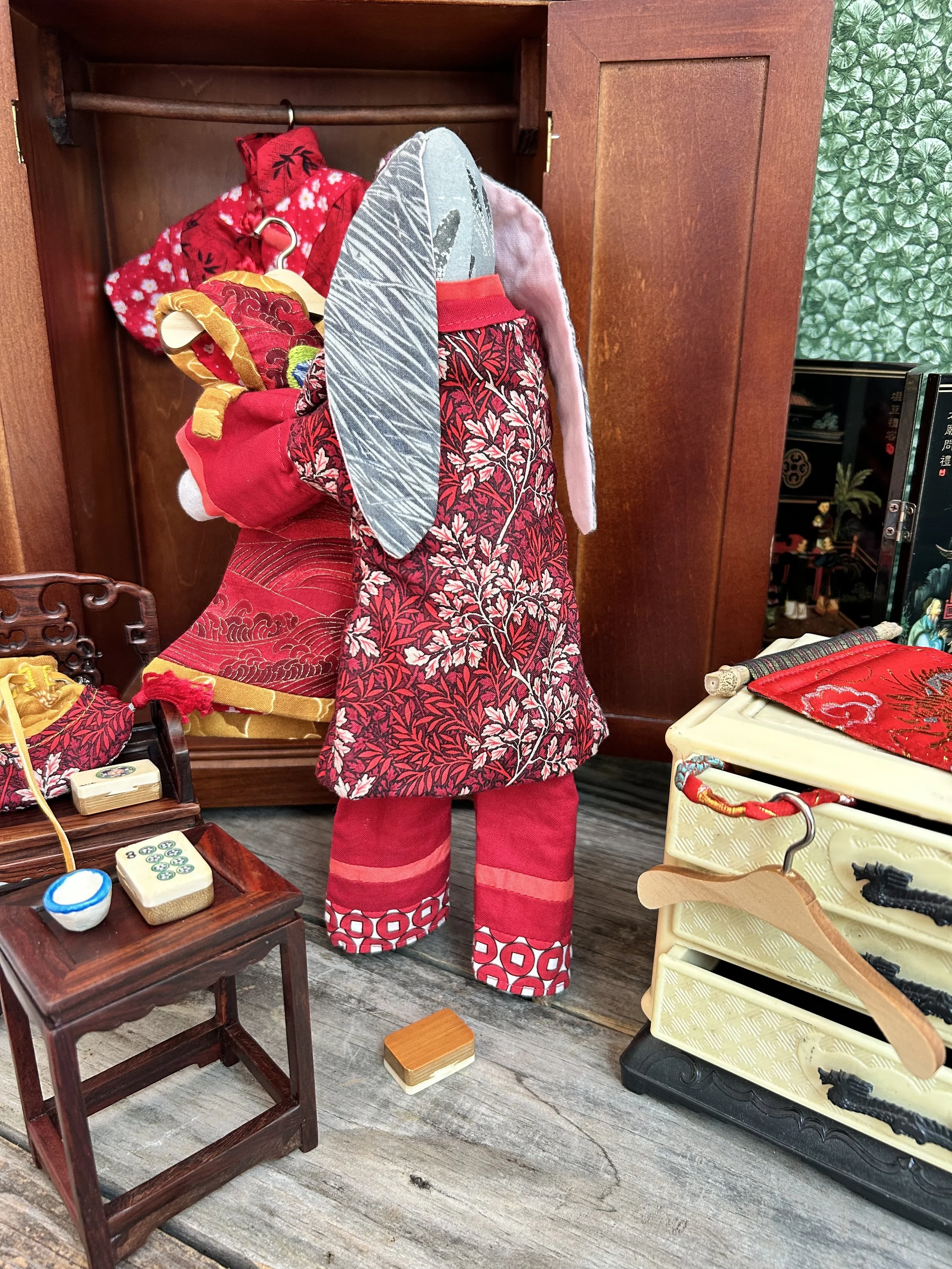 Chinese New Year Bunny puts away her clothes and tidies her bedroom.