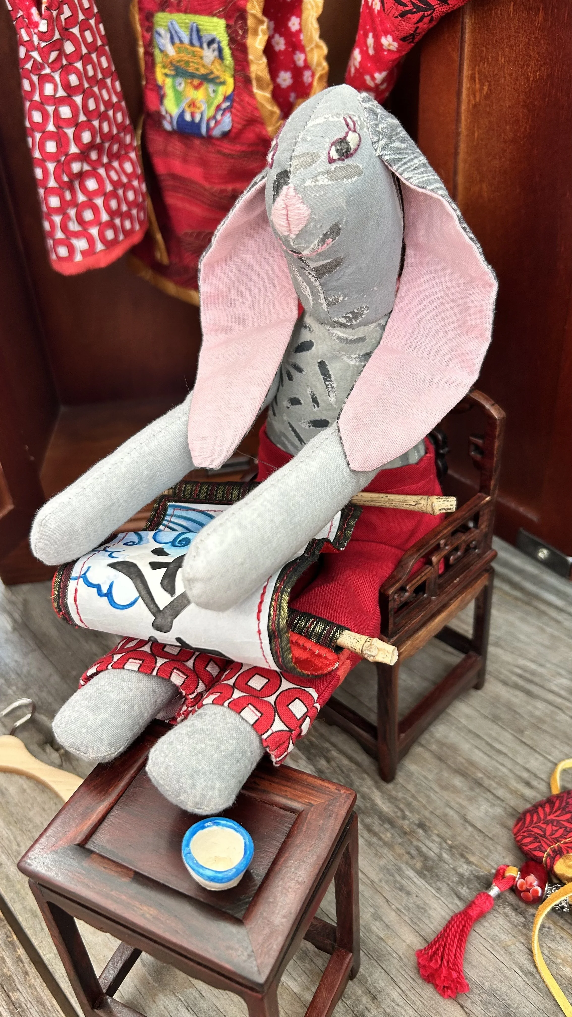 Chinese New Year Bunny takes a moment to look at her invitation to tea from the Jade Emperor.