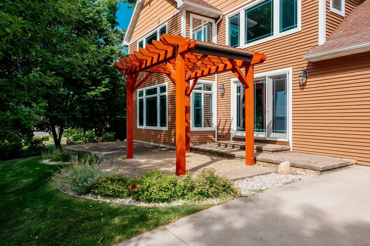 Patio and timber pergola at the front of the home