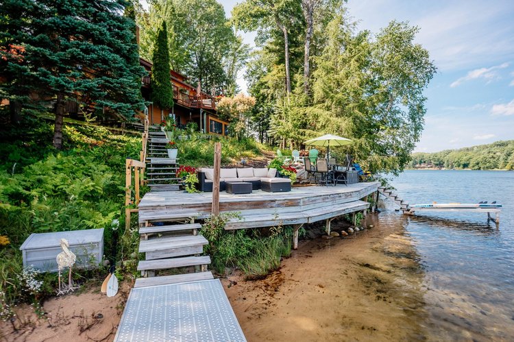 Lakeside deck and sandy shoreline