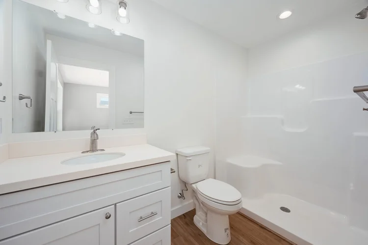 Primary bathroom with vanity and walk in shower