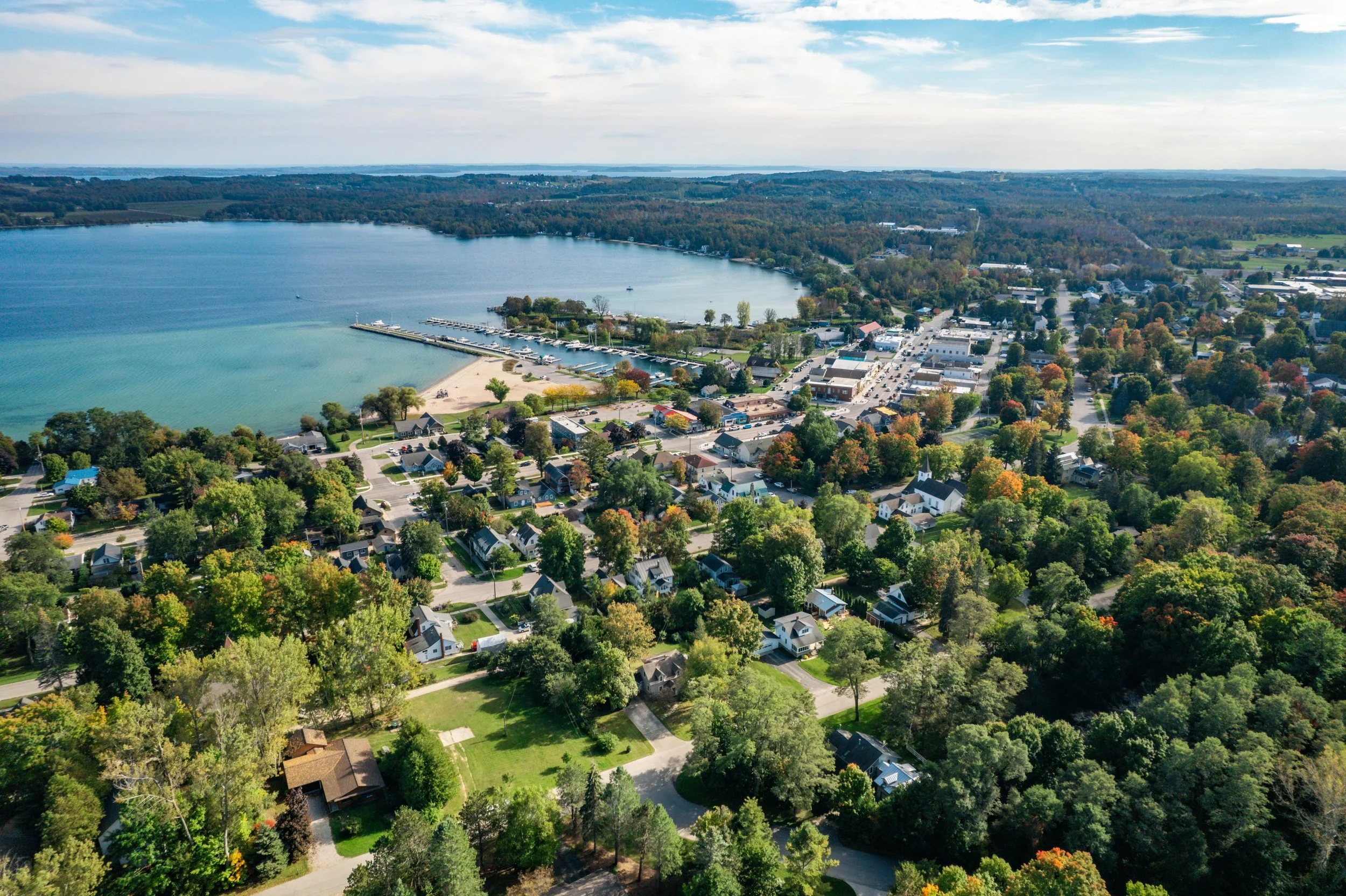 Suttons Bay Is a 15-Minute Drive and a $200K Price Jump from Traverse City. Here’s Why People Pay It.