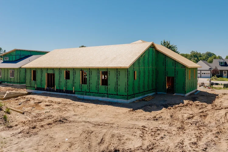 Rear corner view of the home under construction