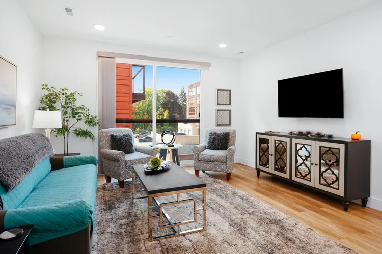 Living room with sofa, chairs and television