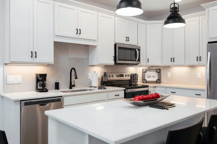 Kitchen counters with stainless appliances