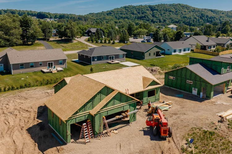 Closer aerial of the front and garage framing