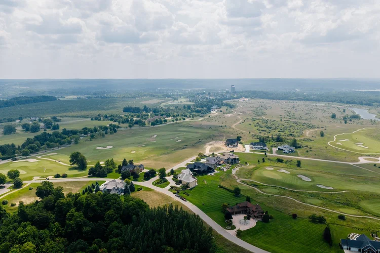 Aerial of neighborhood homes and golf course