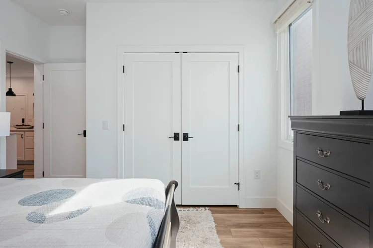 Bedroom with double-door closet