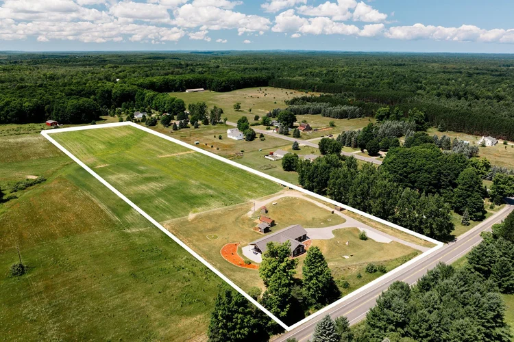 Aerial view with the property boundary outlined in white