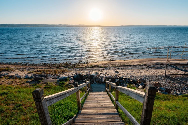 Stairs down to the beach at sunset