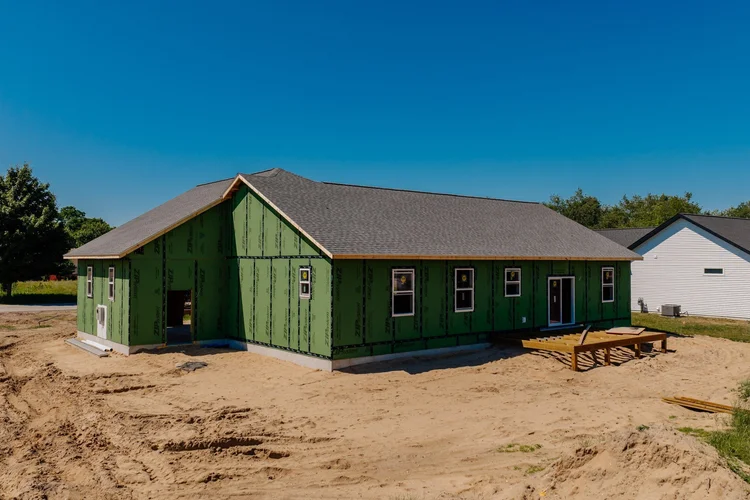 Rear corner view of the home under construction