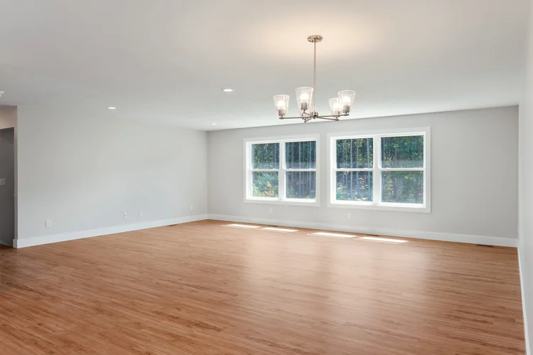 Dining area with chandelier and four windows