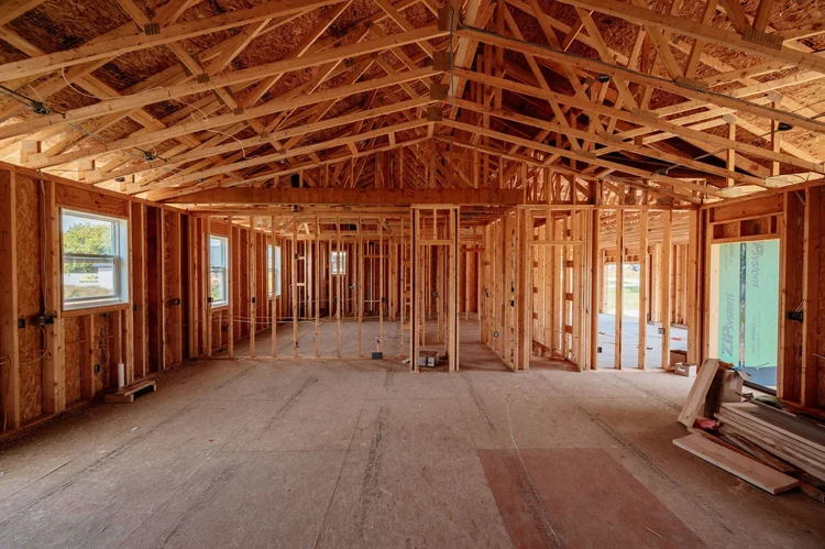 Framed open living area with exposed roof trusses