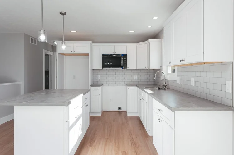Kitchen counters, sink and subway tile backsplash