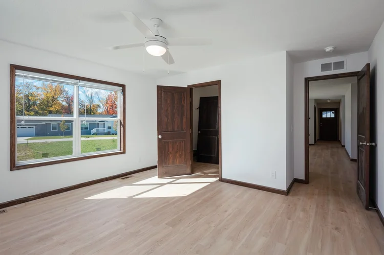 Bedroom with ceiling fan and window