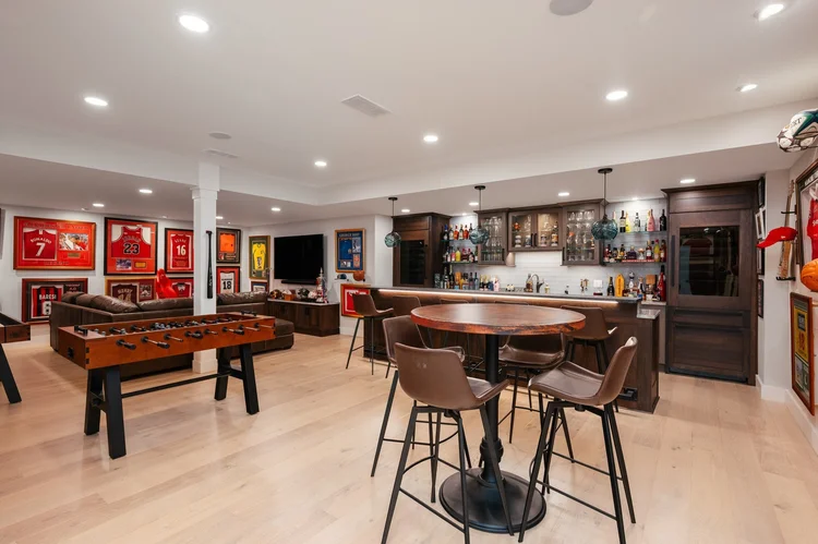 Lower level recreation room with bar and foosball table