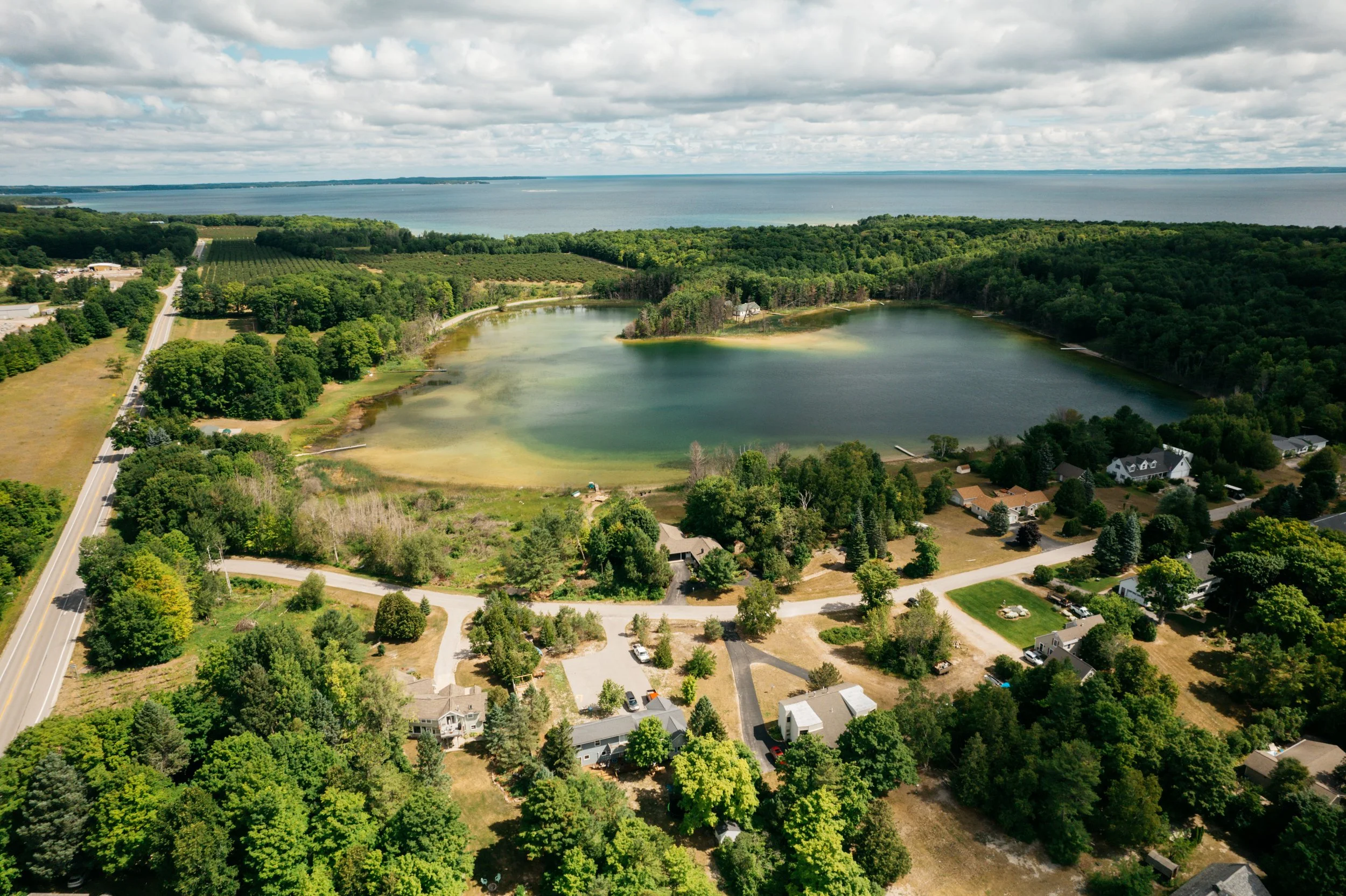 omena private road real estate drone photo summer lake michigan